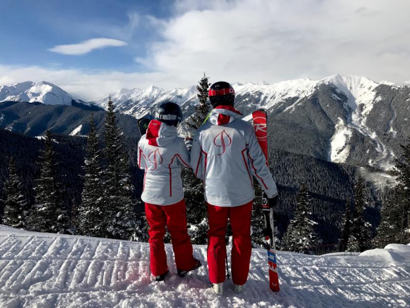 Two Aspen Ski instructors looking at the view during the Magic of Skiing program
